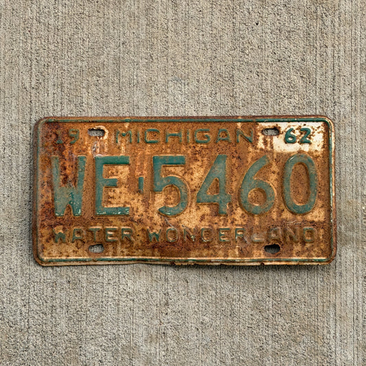Photo of a 1962 Michigan License Plate Auto Tag Garage Decor Vintage WE 5460 with original patina