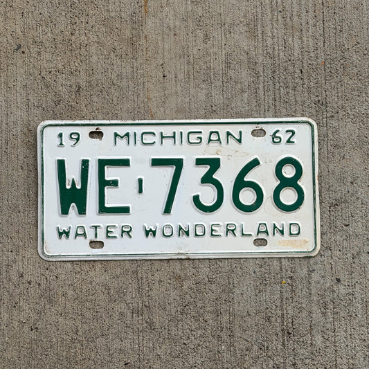 Photo of a 1962 Michigan License Plate Auto Tag Garage Decor Vintage WE 7368 with original patina