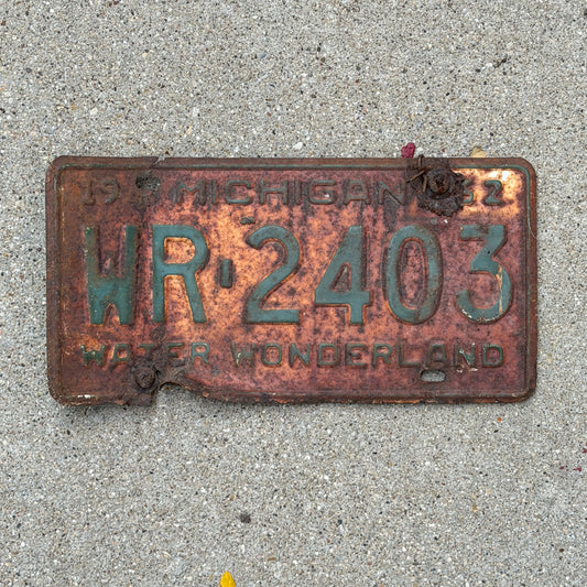 Photo of a 1962 Michigan License Plate Auto Tag Garage Decor Vintage WR 2403 with original patina