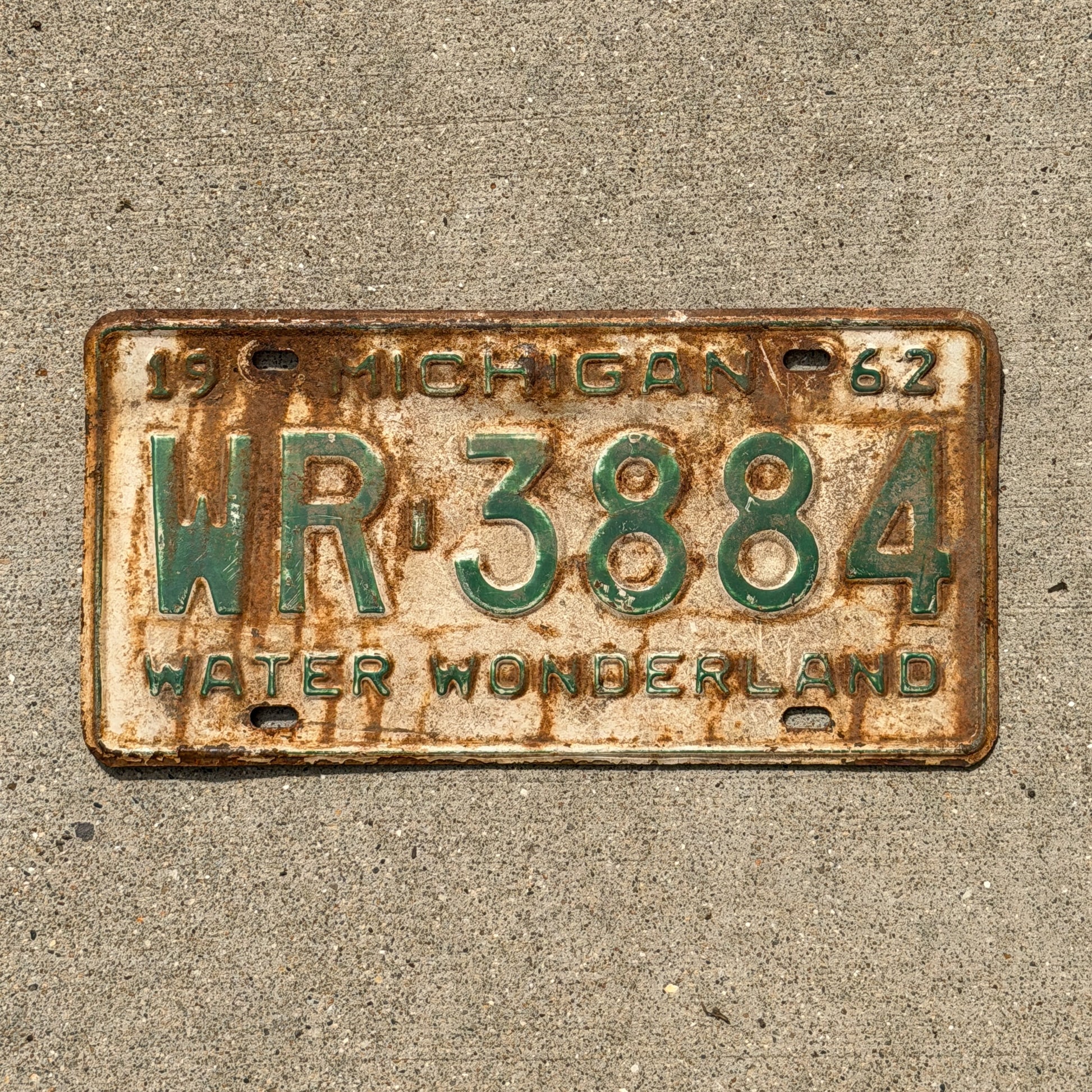 Photo of a 1962 Michigan License Plate Auto Tag Garage Decor Vintage WR 3884 with original patina