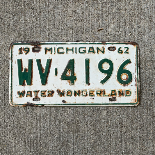 Photo of a 1962 Michigan License Plate Auto Tag Garage Decor Vintage WV 4196 with original patina