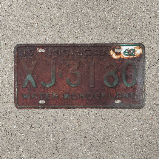 Photo of a 1962 Michigan License Plate Auto Tag Garage Decor Vintage XJ 3180