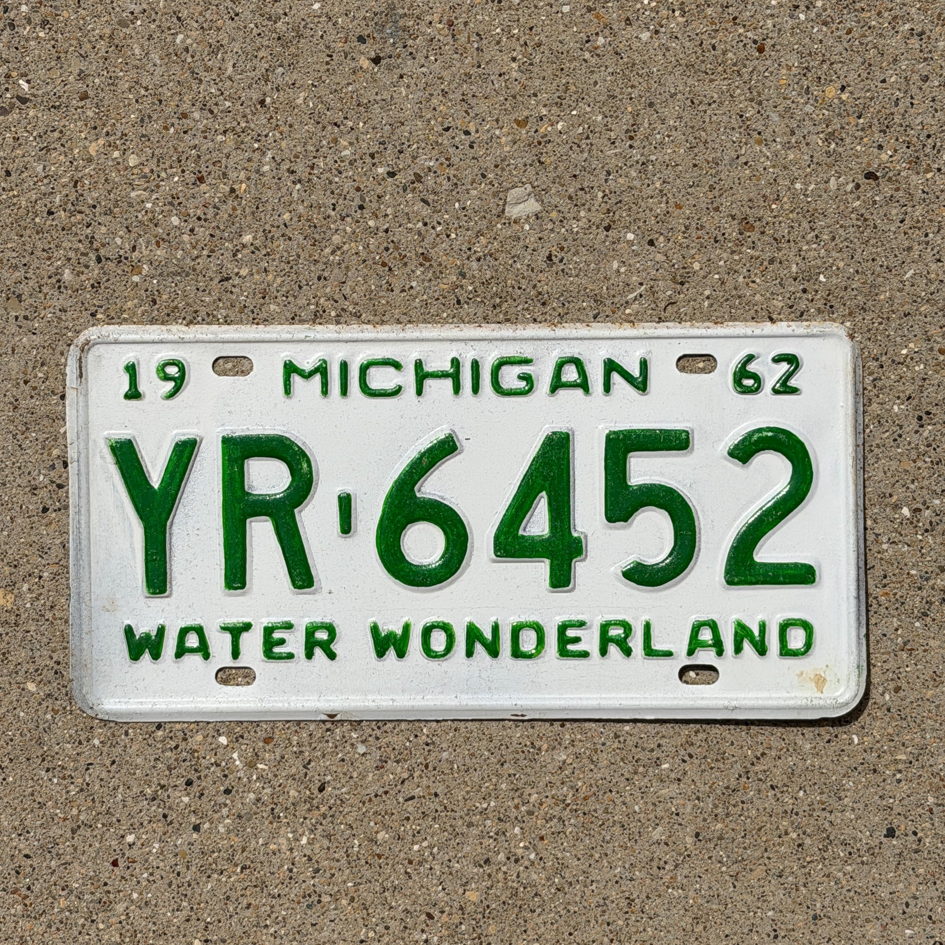 Photo of a 1962 Michigan License Plate Auto Tag Garage Decor Vintage YR 6452 with original patina