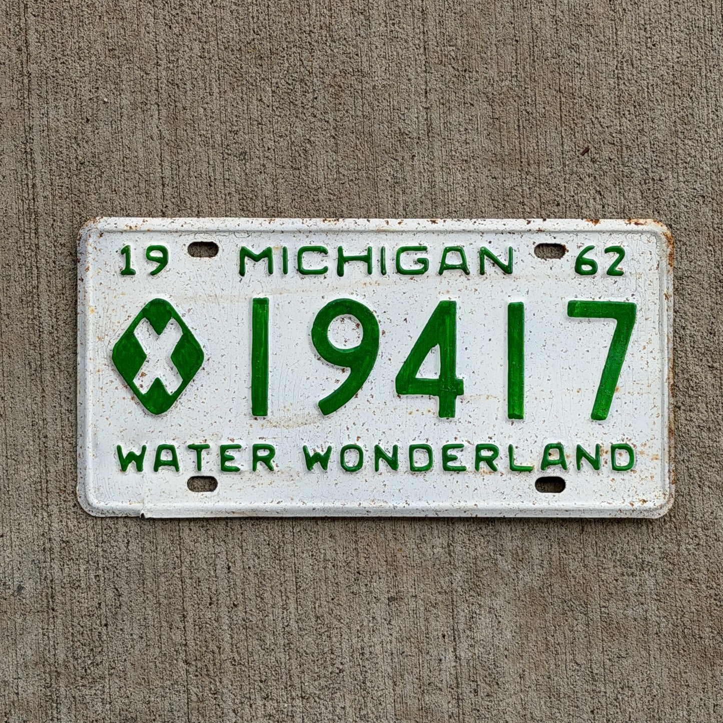 Photo of a 1962 Michigan Municipal License Plate Auto Tag Garage Decor Vintage 19417 with original patina