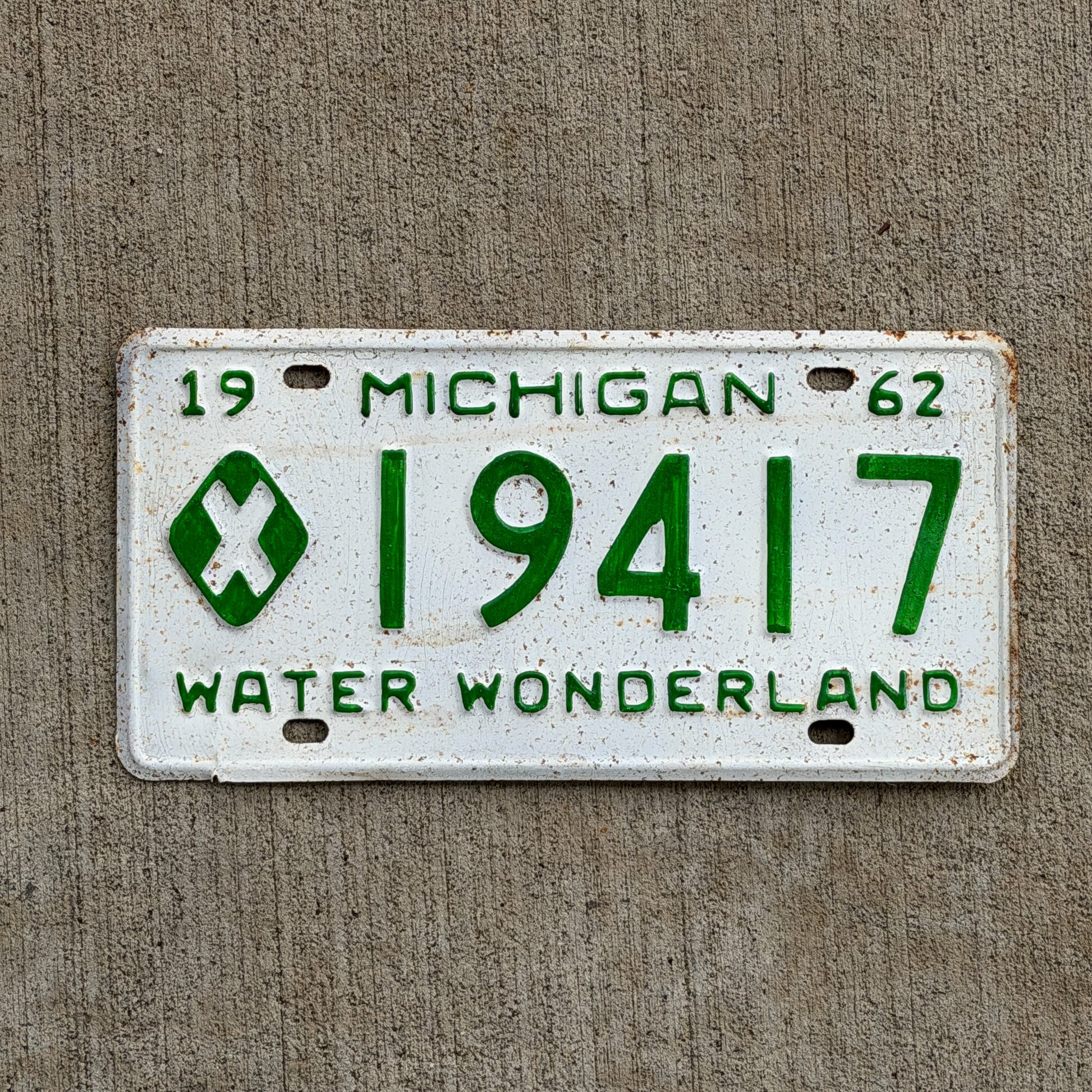 Photo of a 1962 Michigan Municipal License Plate Auto Tag Garage Decor Vintage 19417 with original patina