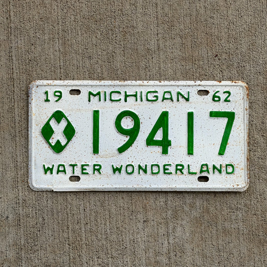 Photo of a 1962 Michigan Municipal License Plate Auto Tag Garage Decor Vintage 19417 with original patina