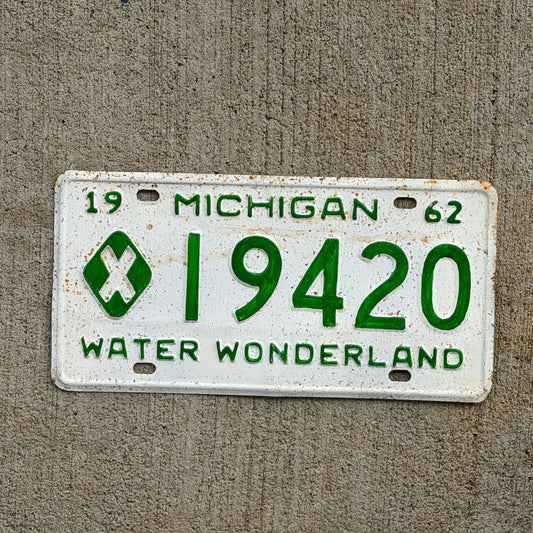 Photo of a 1962 Michigan Municipal License Plate Auto Tag Garage Decor Vintage 19420 with original patina