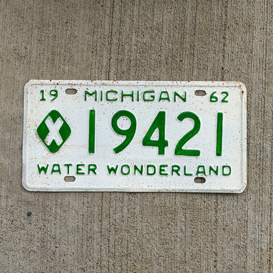 Photo of a 1962 Michigan Municipal License Plate Auto Tag Garage Decor Vintage 19421 with original patina