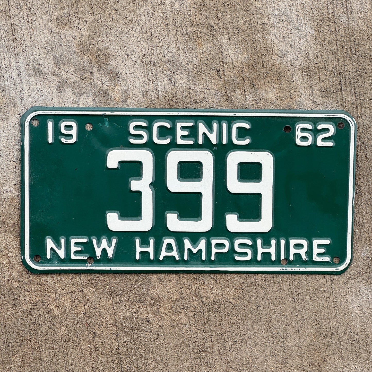 Photo of a 1962 New Hampshire License Plate Auto Tag 2 Vintage Garage Low Number Three Digit 399 with original patina