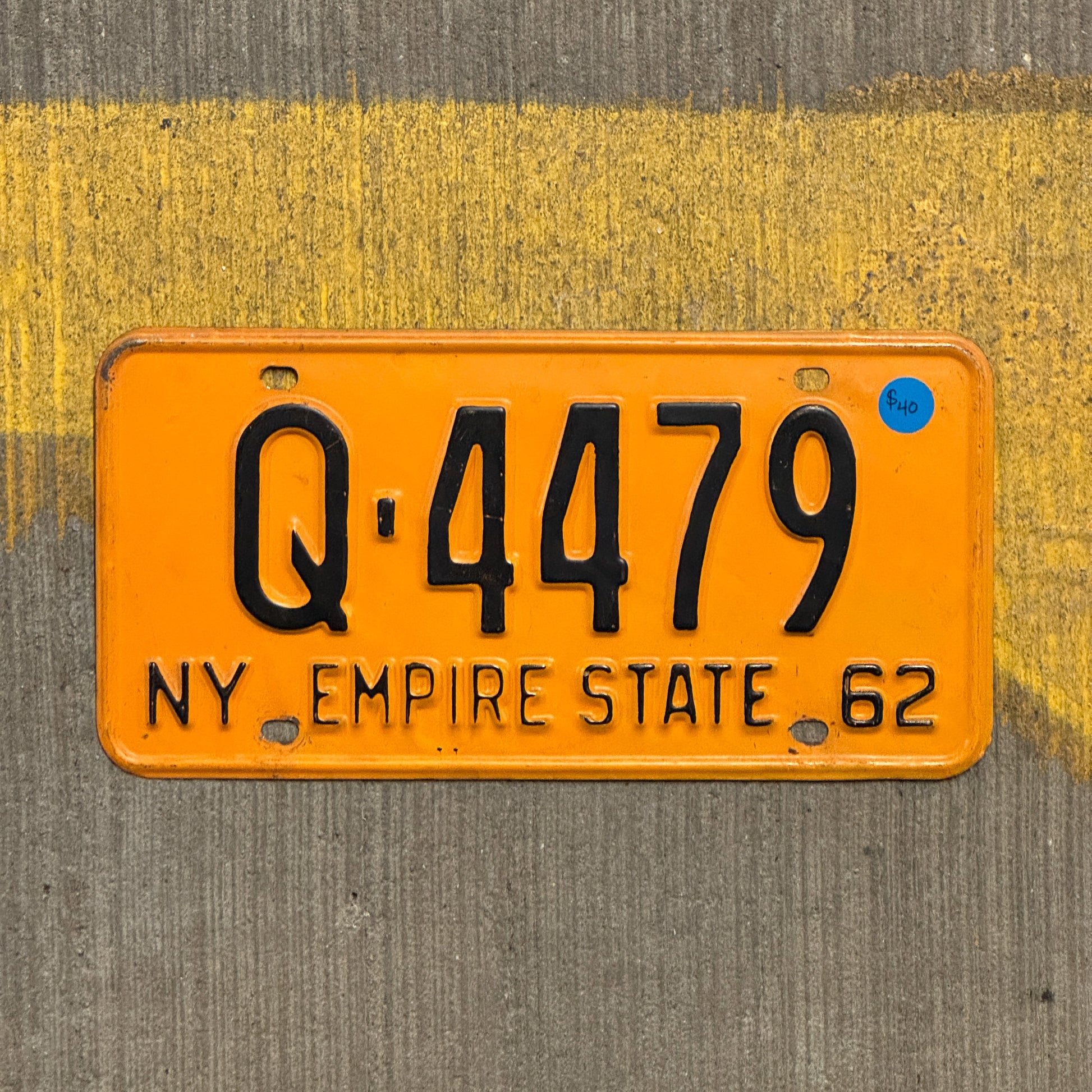 Photo of a 1962 New York License Plate Auto Tag Garage Decor Vintage Q 4479 with original patina