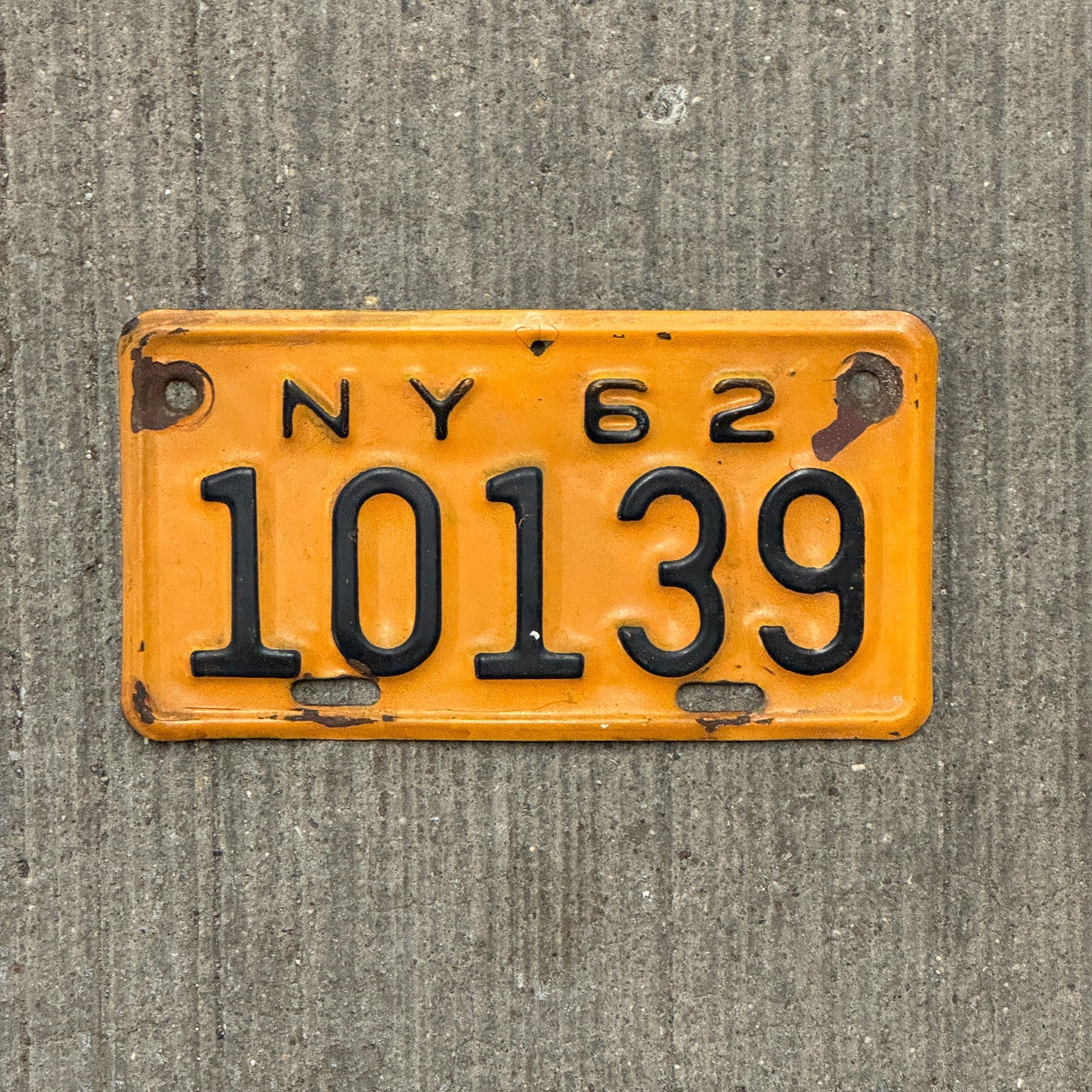 Photo of a 1962 New York Motorcycle License Plate Auto Tag Garage Decor Vintage 10139 with original patina