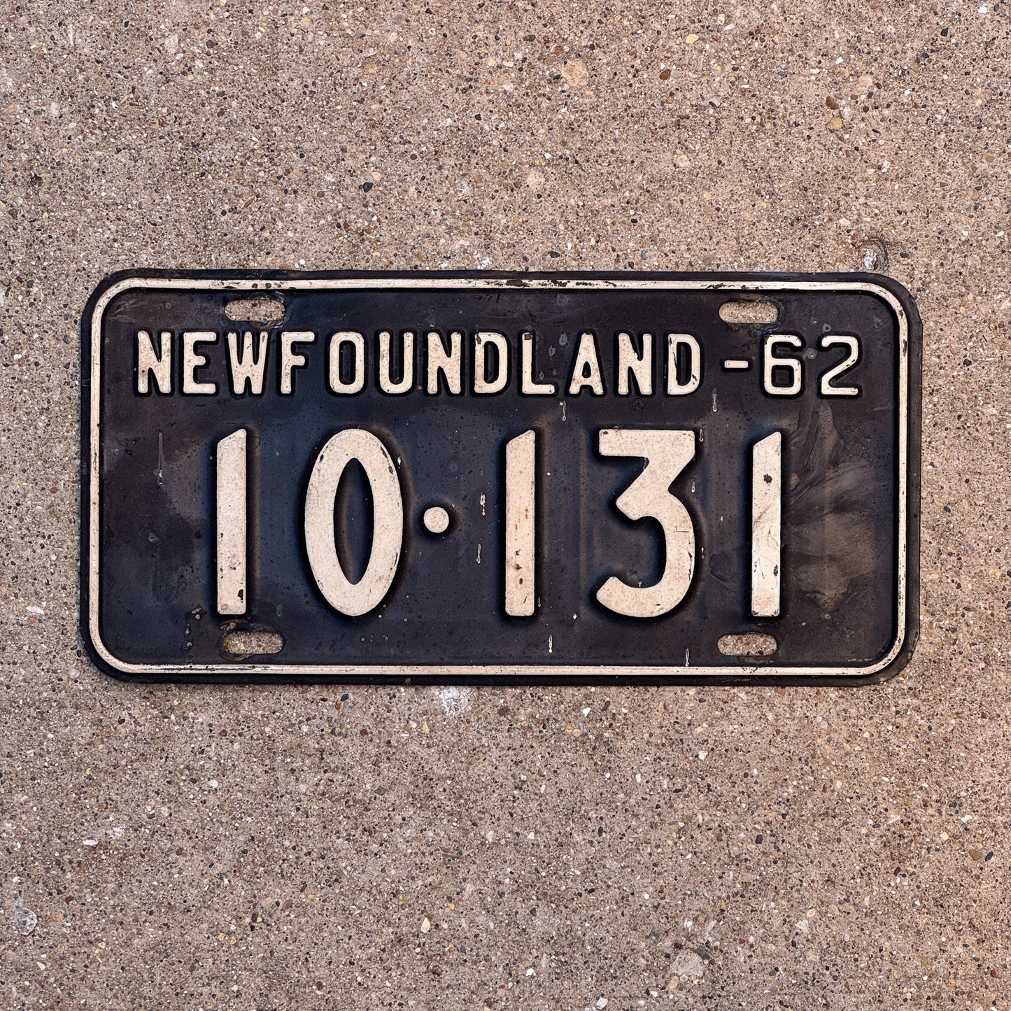 Photo of a 1962 Newfoundland License Plate Auto Tag Garage Decor Vintage Canada 10 131 with original patina