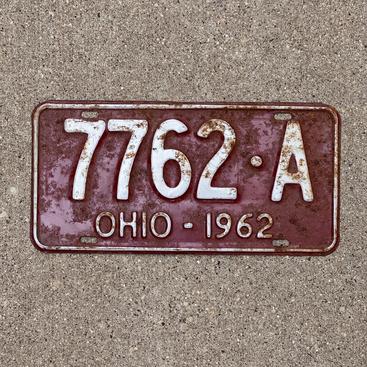 Photo of a 1962 Ohio License Plate Auto Tag Garage Decor Vintage 7762 A with original patina