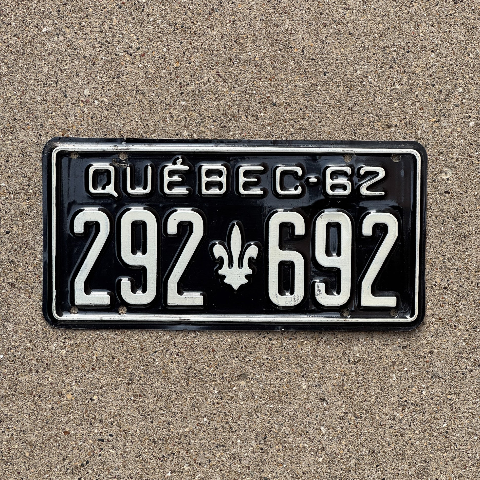Photo of a 1962 Quebec License Plate Auto Tag Garage Decor Vintage 292 692 with original patina