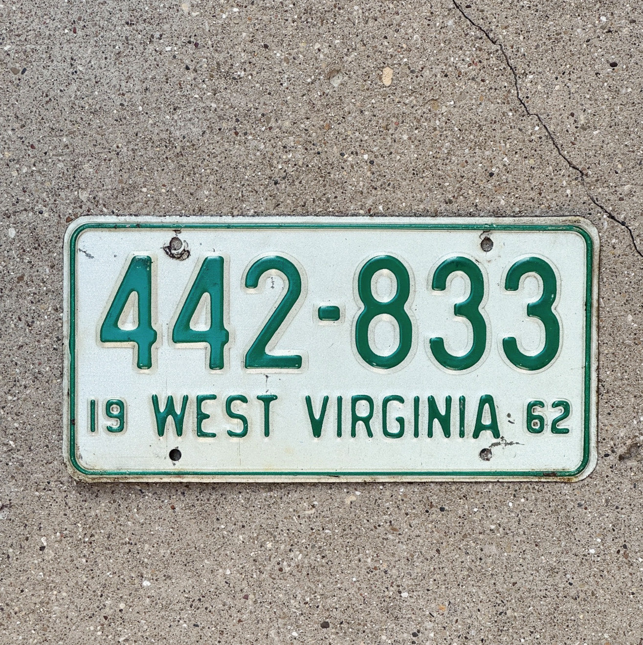 Photo of a 1962 West Virginia License Plate Auto Tag Garage Decor Vintage 442 833 with original patina