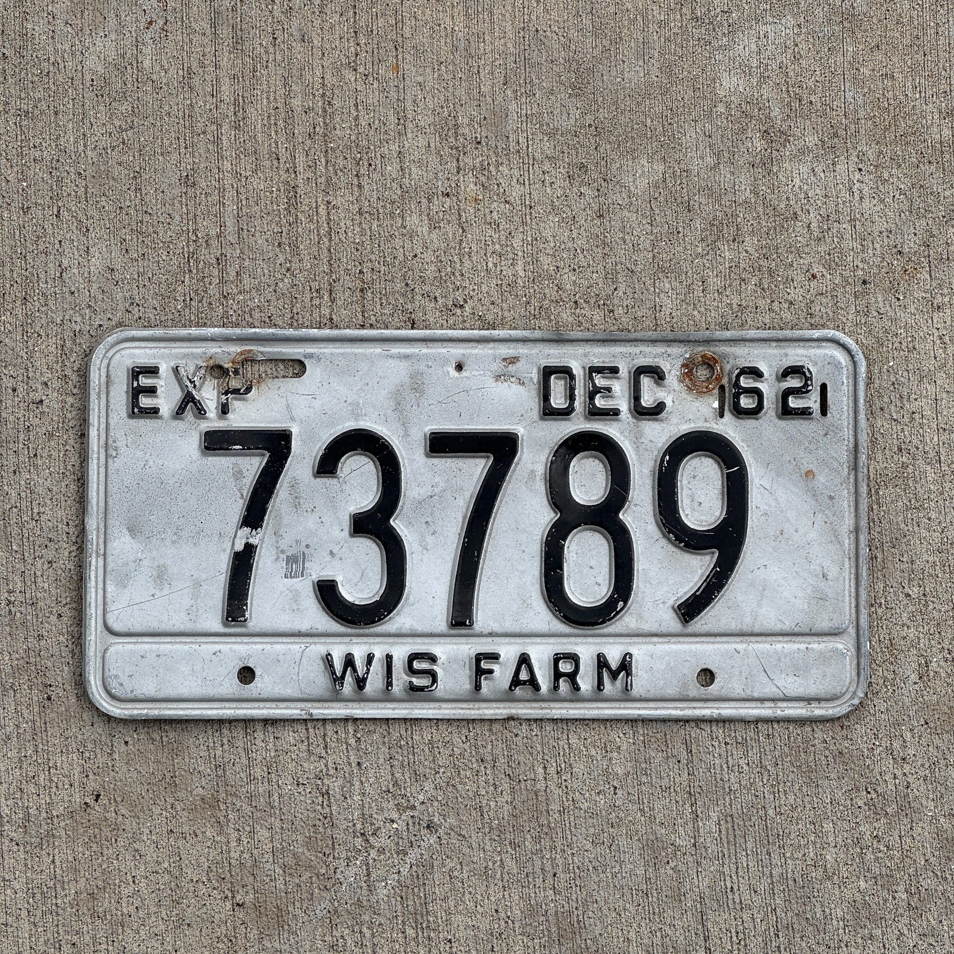 Photo of a 1962 Wisconsin Farm License Plate Auto Tag 2 Vintage Garage 73789 with original patina