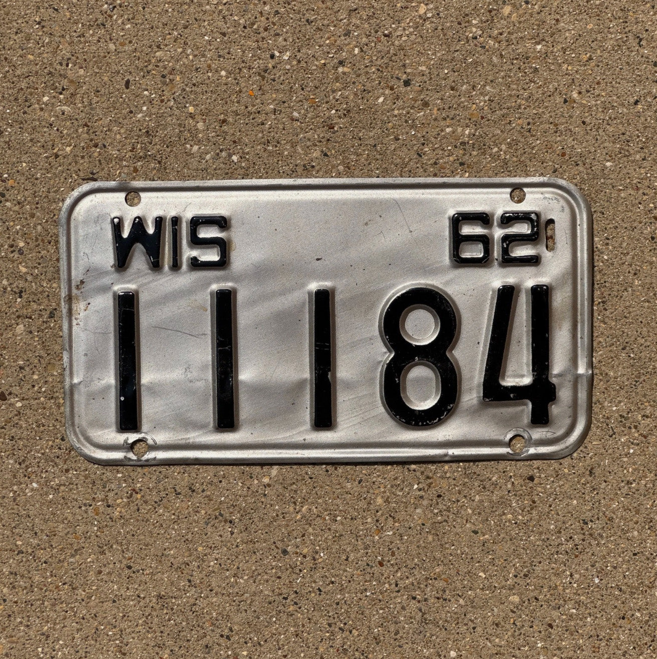 Photo of a 1962 Wisconsin Motorcycle License Plate Auto Tag Garage Decor Vintage Repeat Repeating 11184 with original patina