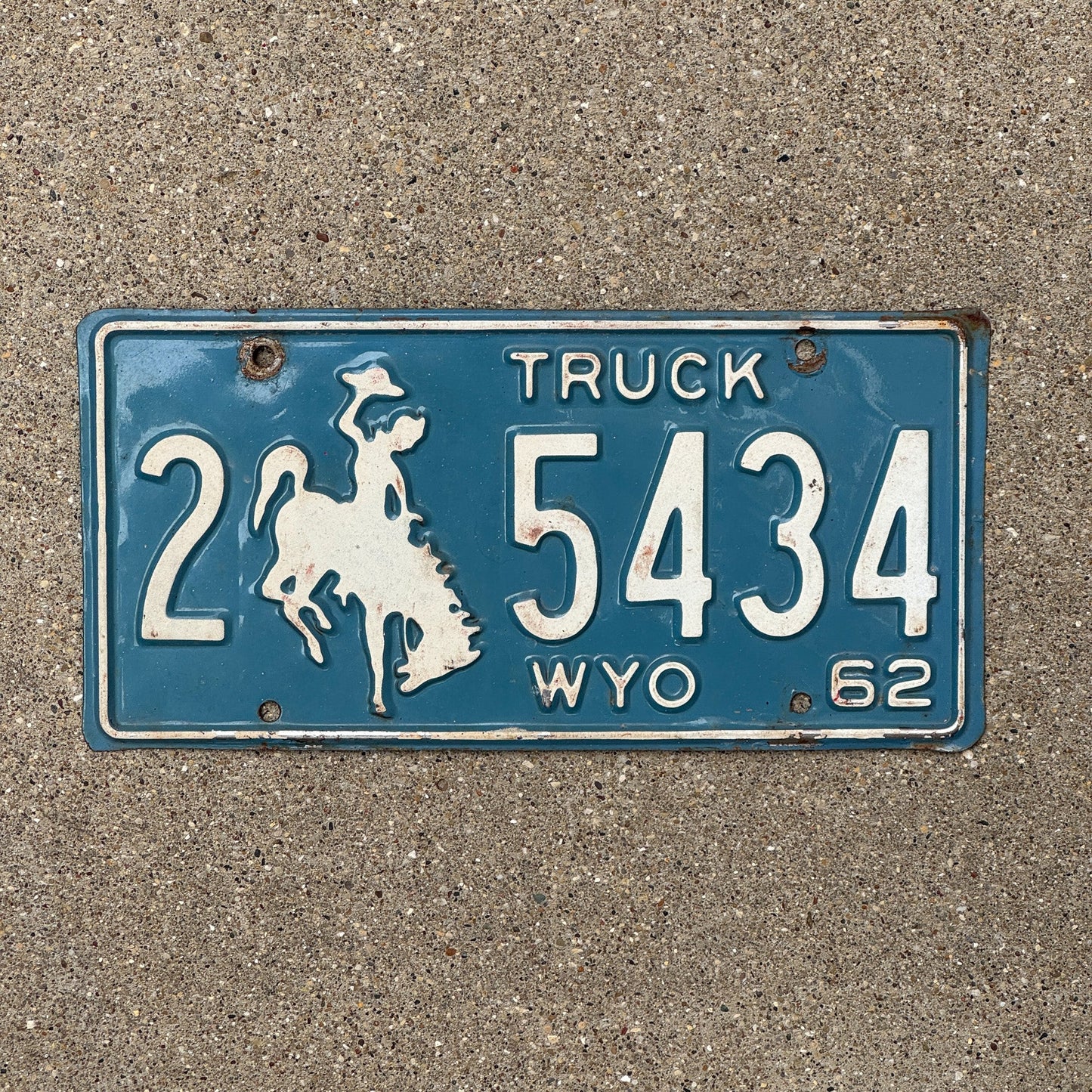 Photo of a 1962 Wyoming Truck License Plate Auto Tag Garage Decor Vintage 2 5434 with original patina