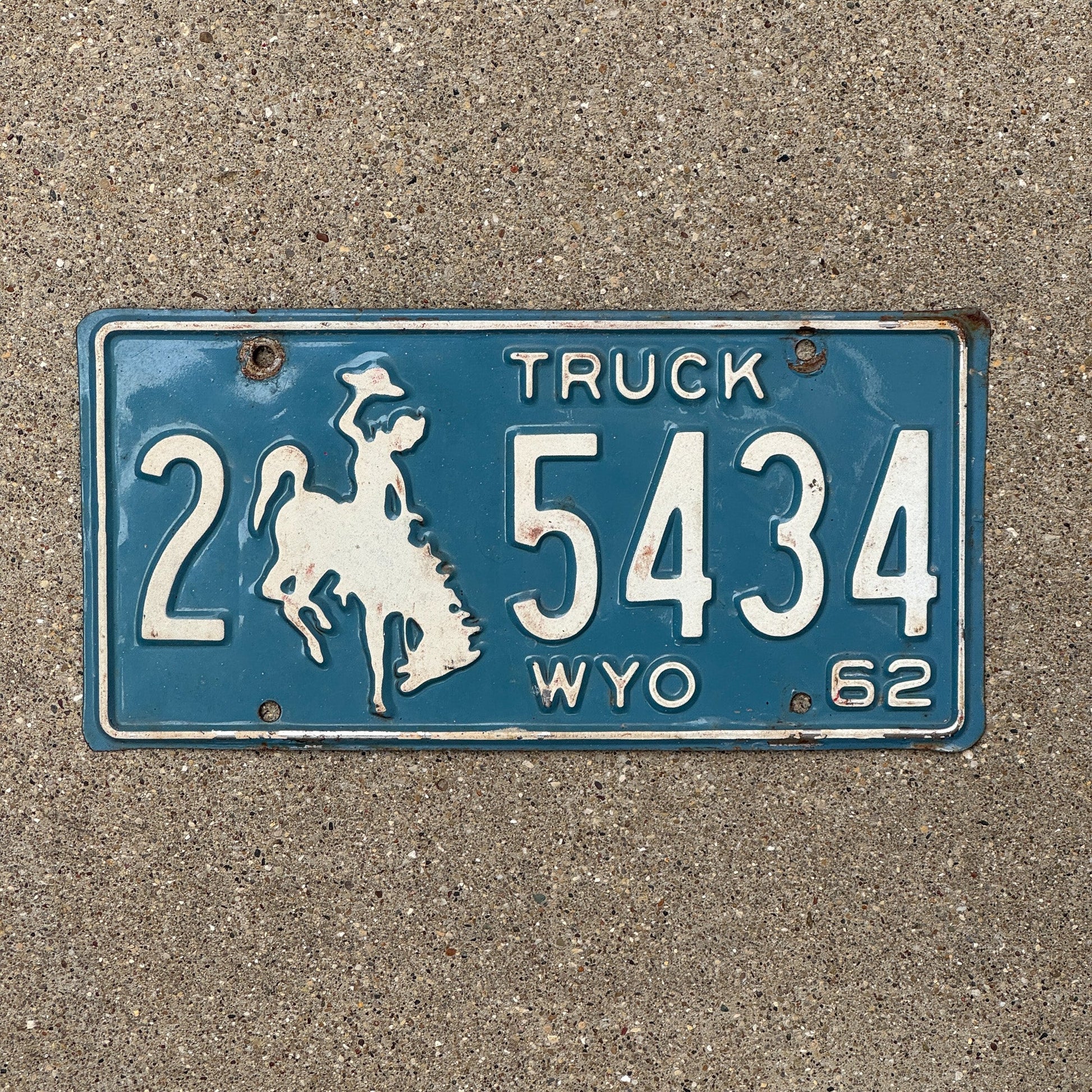 Photo of a 1962 Wyoming Truck License Plate Auto Tag Garage Decor Vintage 2 5434 with original patina