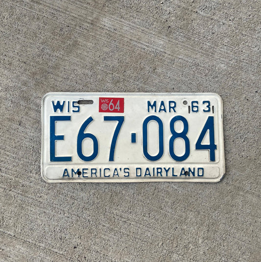 Photo of a 1963 1964 Wisconsin License Plate Auto Tag Garage Decor Vintage E 67 084 with original patina