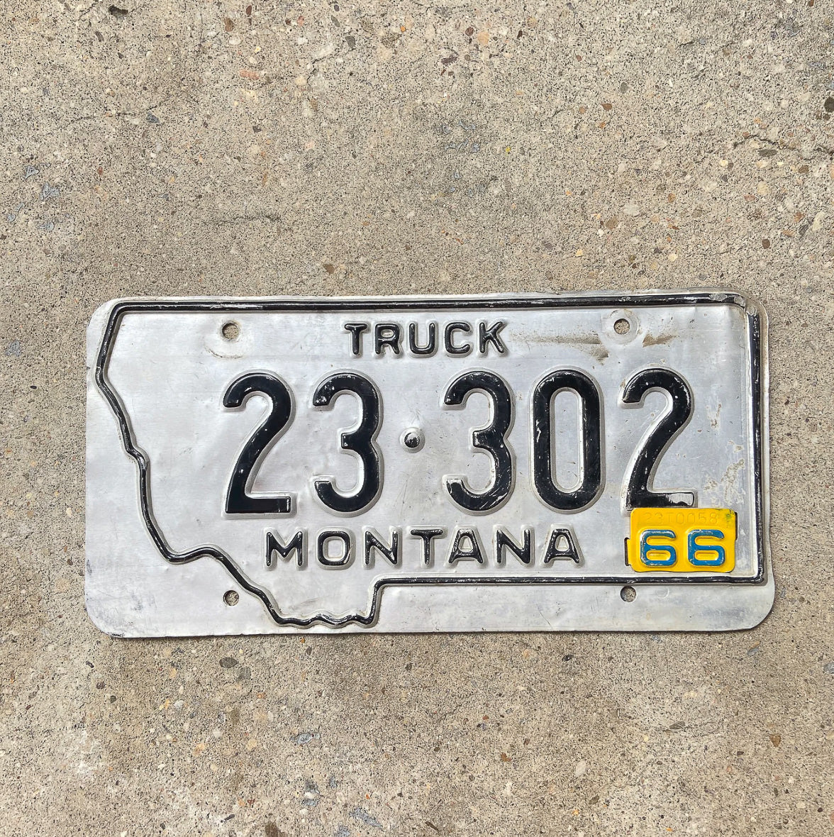 Photo of a 1963 1966 Montana Truck License Plate Auto Tag Garage Decor Vintage State Shape 23 302 with original patina