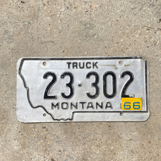 Photo of a 1963 1966 Montana Truck License Plate Auto Tag Garage Decor Vintage State Shape 23 302 with original patina