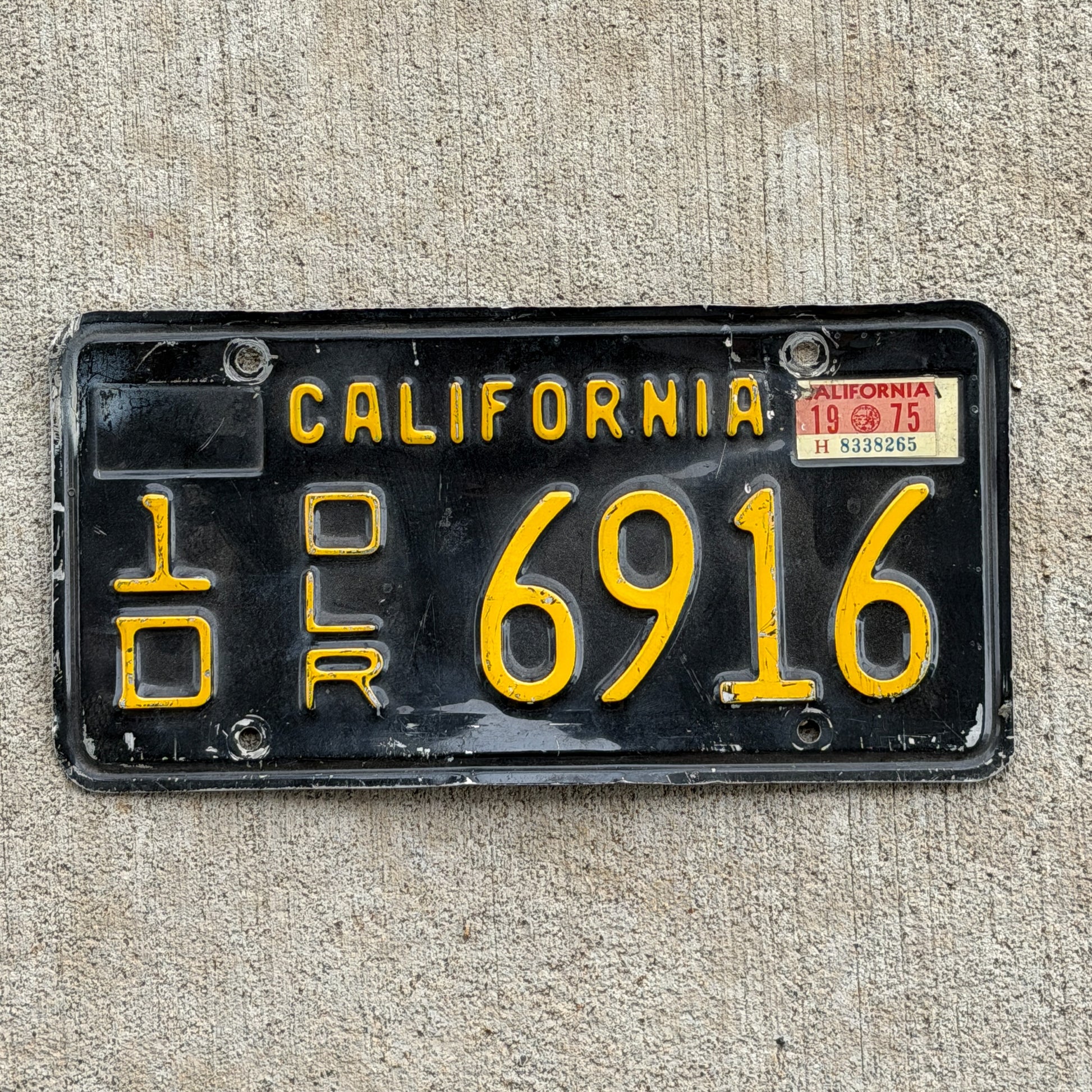 Photo of a 1963 1975 California Dealer License Plate Auto Tag 1 Vintage Garage 1D 6916 with original patina