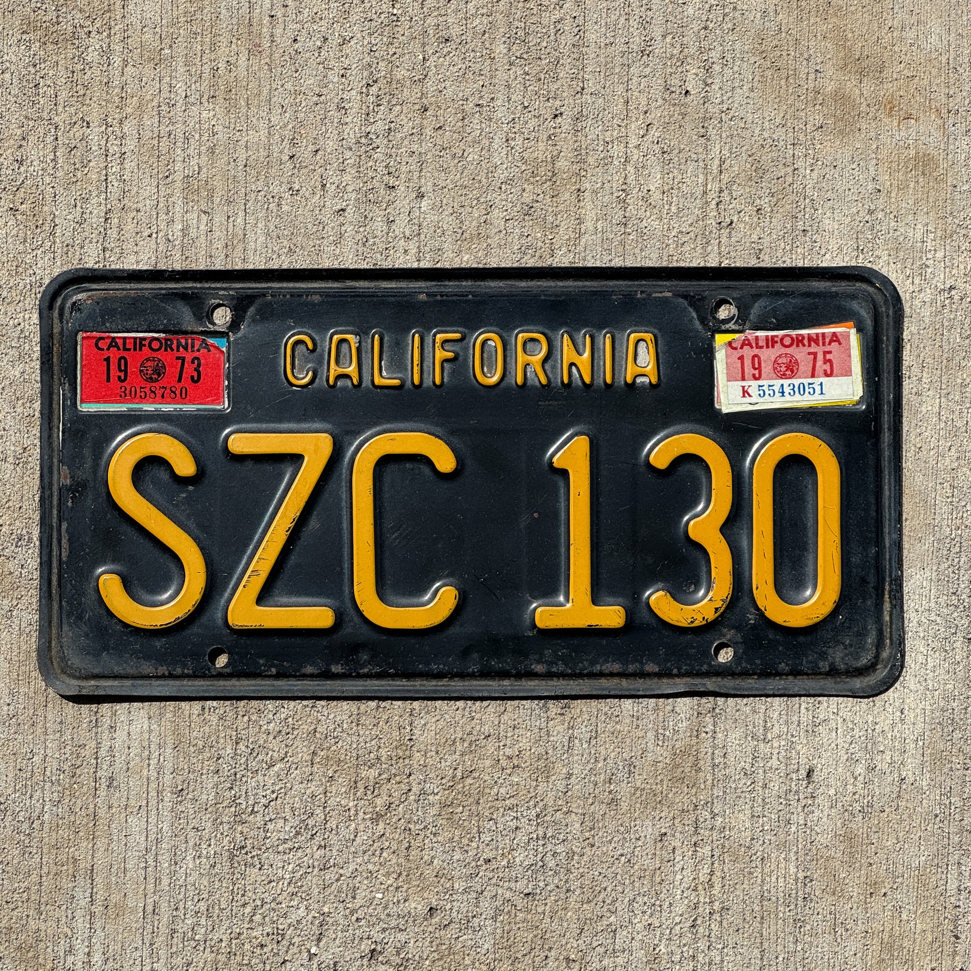 Photo of a 1963 1975 California License Plate Auto Tag Garage Decor Vintage SZC 130 with original patina