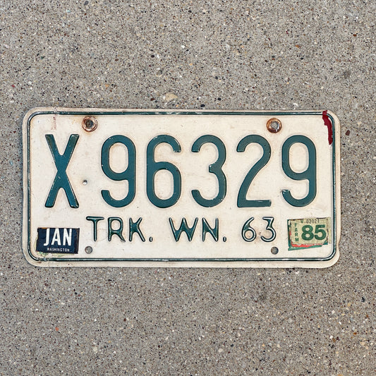 Photo of a 1963 1985 Washington Truck License Plate Auto Tag Garage Decor Vintage DMV Clear Number X 96329 with original patina