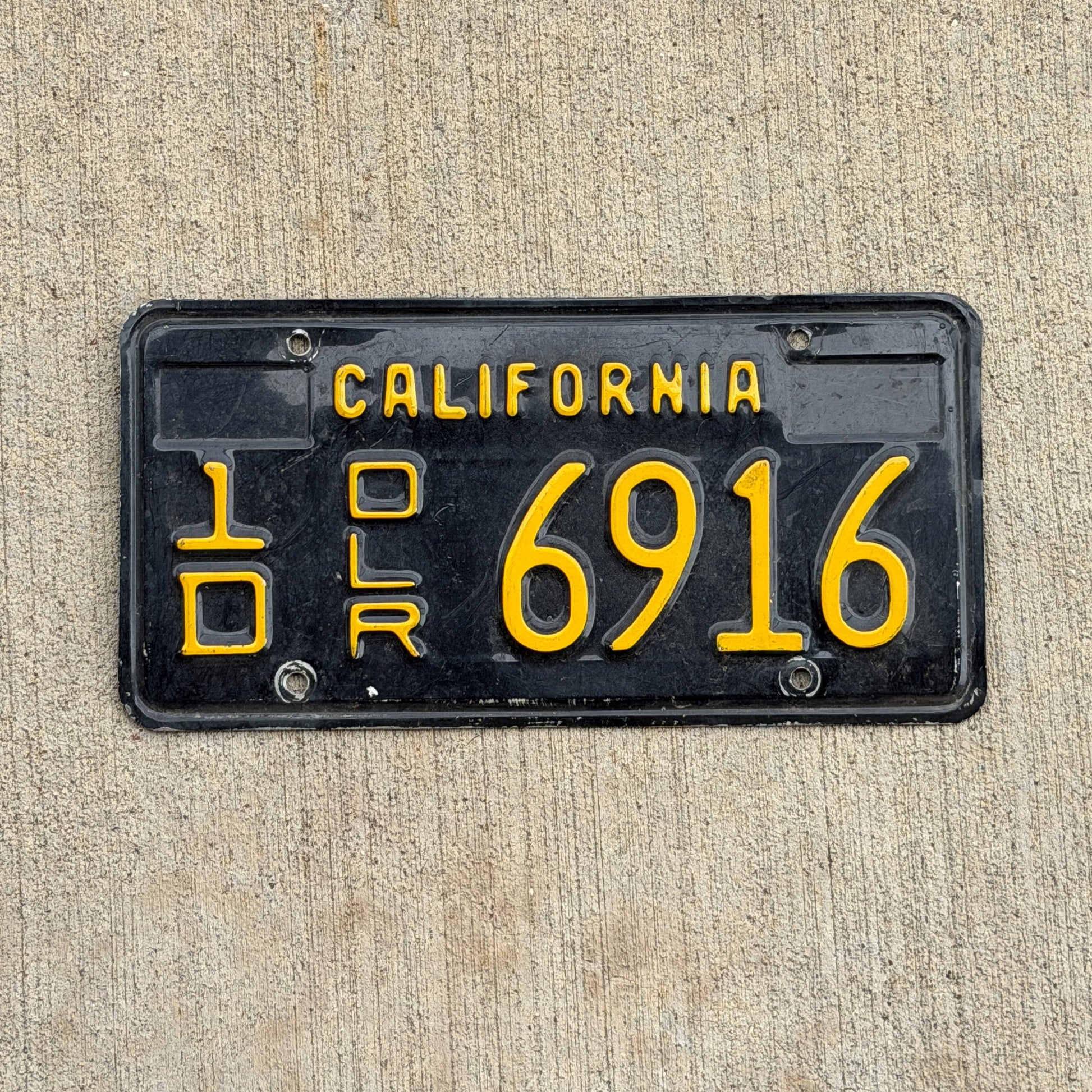 Photo of a 1963 California Dealer License Plate Auto Tag 2 Vintage Garage 1D 6916 with original patina