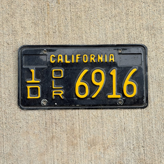 Photo of a 1963 California Dealer License Plate Auto Tag 2 Vintage Garage 1D 6916 with original patina