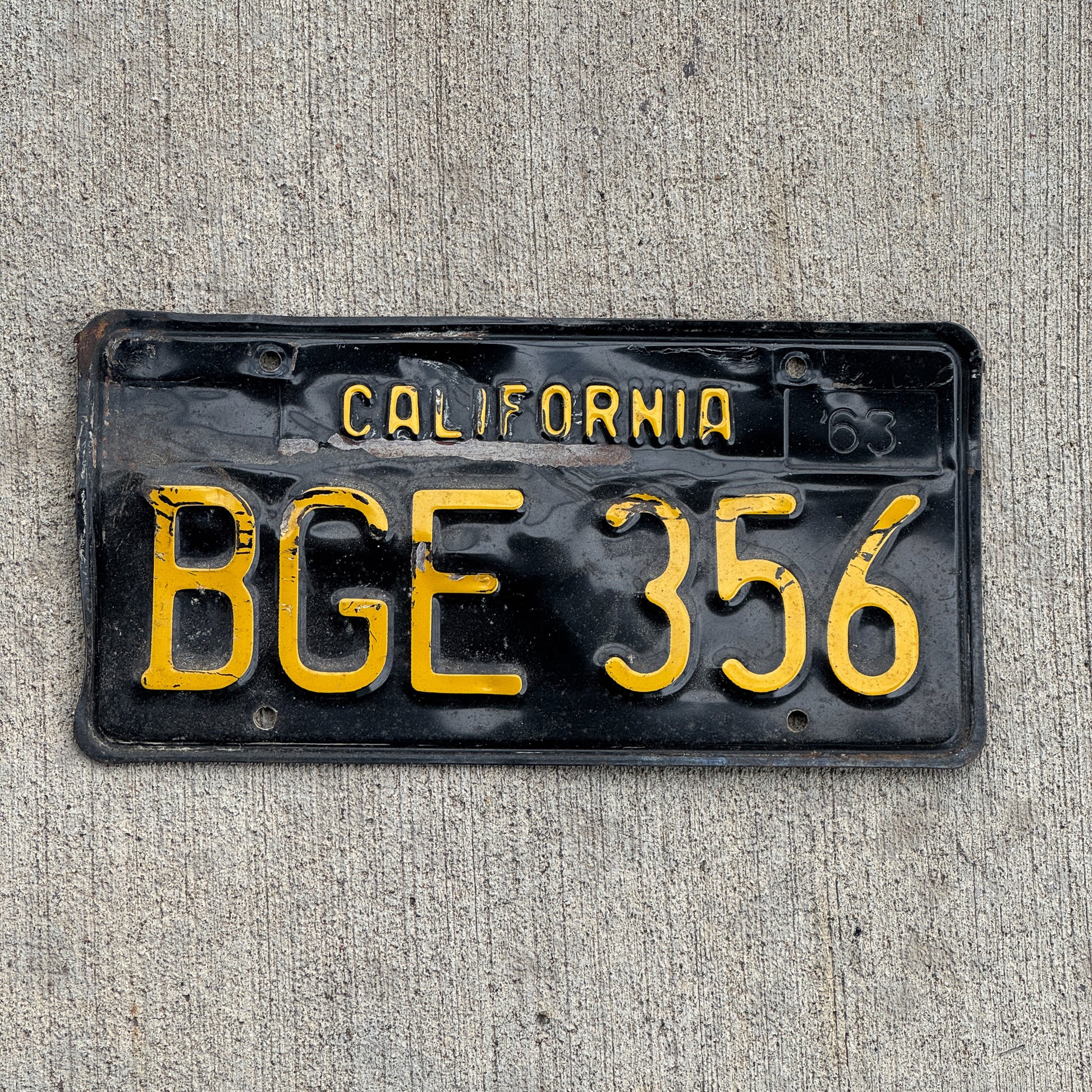 Photo of a 1963 California License Plate Auto Tag Garage Decor Vintage BGE 356 with original patina