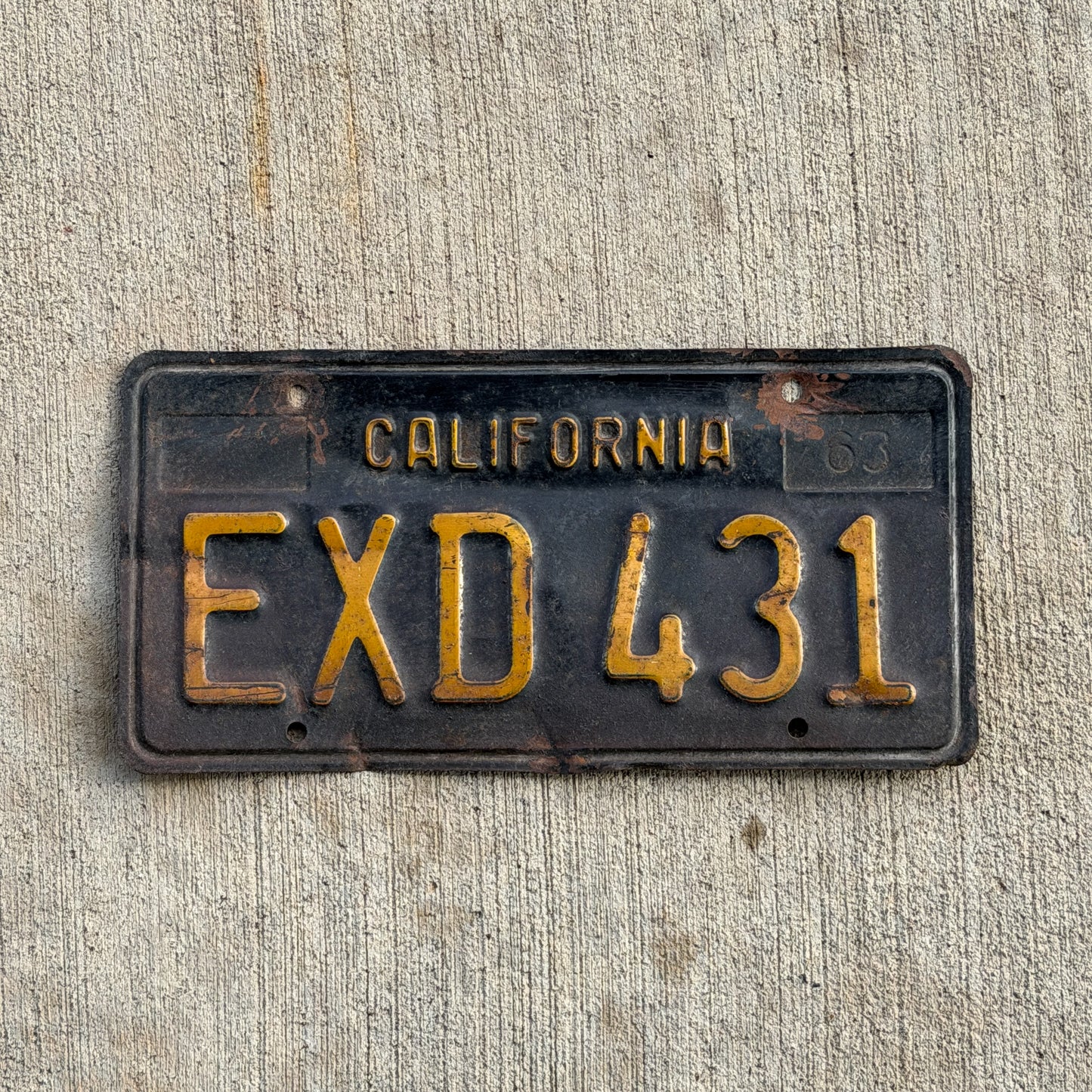 Photo of a 1963 California License Plate Auto Tag Garage Decor Vintage EXD 431 with original patina