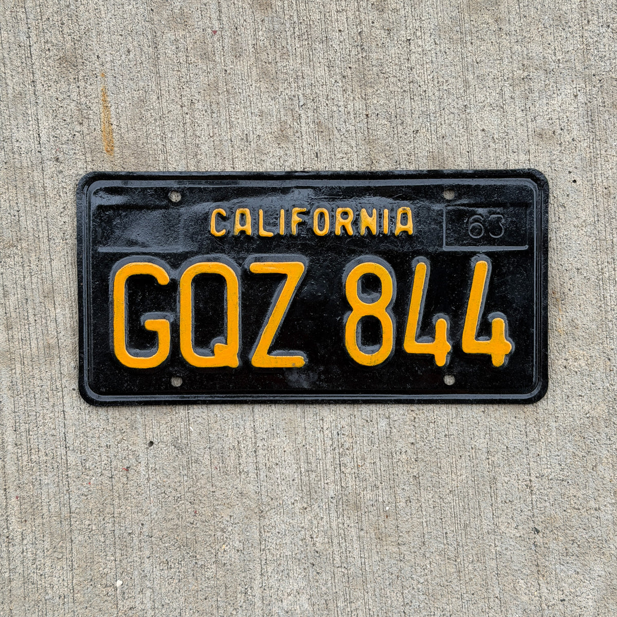 Photo of a 1963 California License Plate Auto Tag Garage Decor Vintage GQZ 844 with original patina