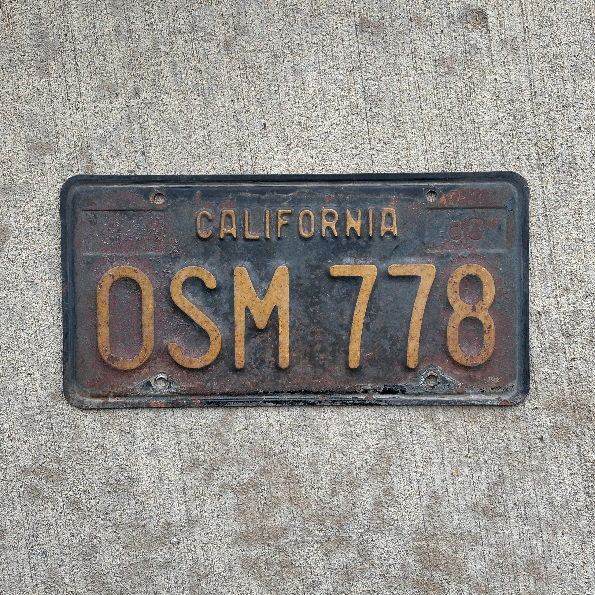 Photo of a 1963 California License Plate Auto Tag Garage Decor Vintage OSM 778 with original patina