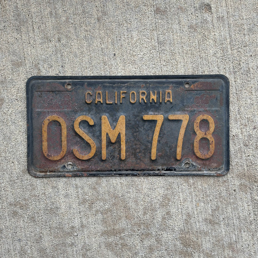 Photo of a 1963 California License Plate Auto Tag Garage Decor Vintage OSM 778 with original patina