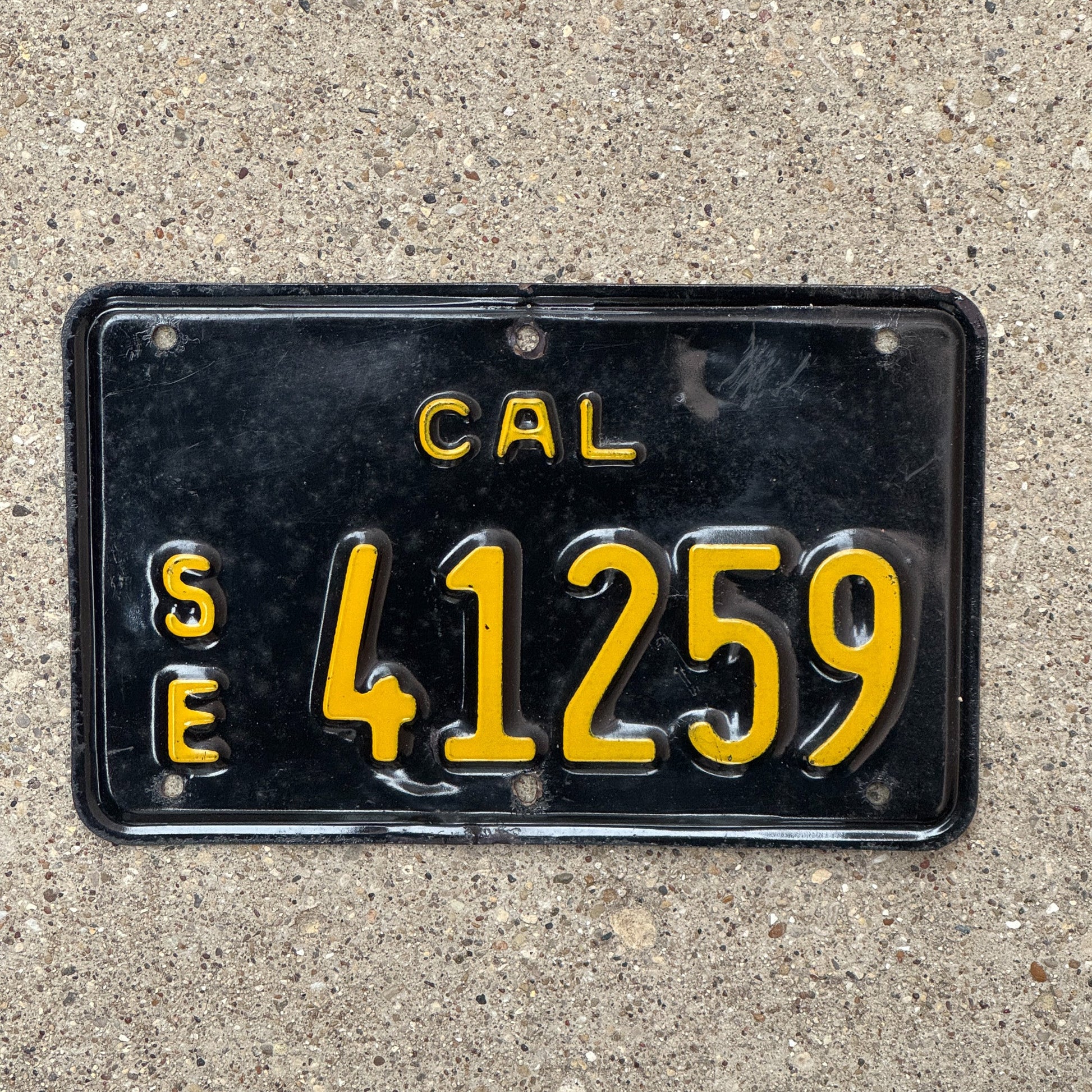 Photo of a 1963 California Special Equipment License Plate Auto Tag Garage Decor Vintage Motorcycle Size SE 41259 with original patina