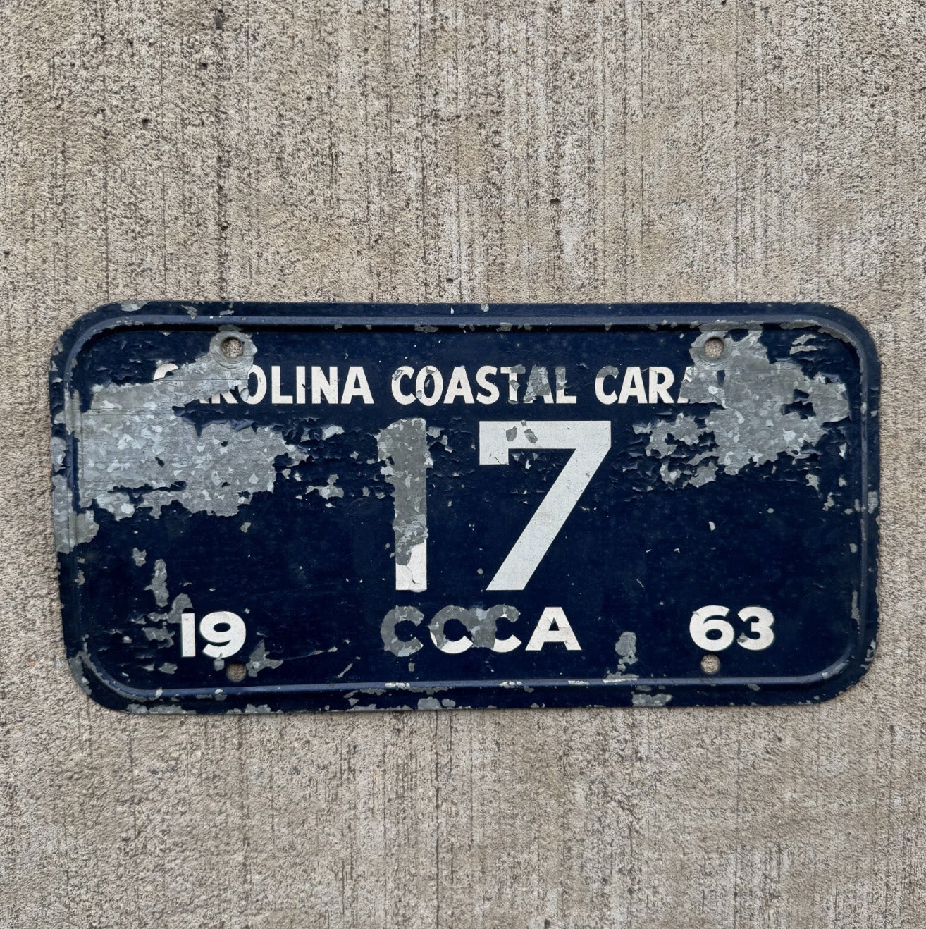 Photo of a 1963 Carolina Coastal Caravan Booster License Plate Auto Tag Garage Decor Vintage CCCA Classic Car Club 17 17 with original patina