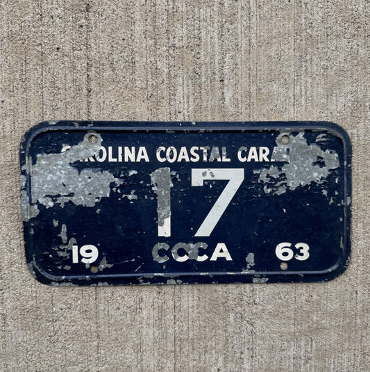 Photo of a 1963 Carolina Coastal Caravan Booster License Plate Auto Tag Garage Decor Vintage CCCA Classic Car Club 17 17 with original patina