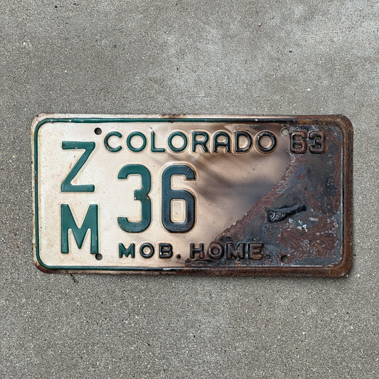 Photo of a 1963 Colorado Mobile Home License Plate Auto Tag Garage Decor Vintage ZM 36