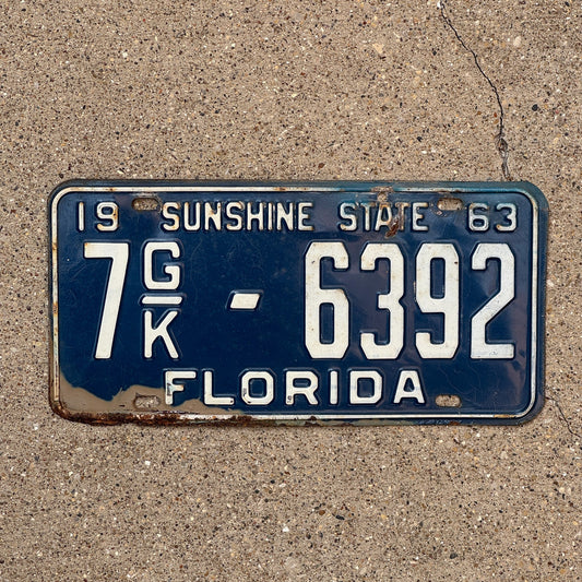 Photo of a 1963 Florida Commercial License Plate Auto Tag Garage Decor Vintage Orange County 7 GK 6392 with original patina