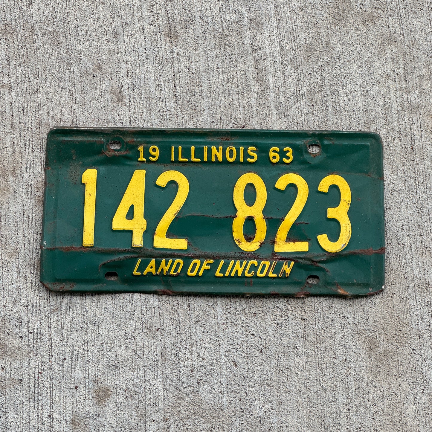 Photo of a 1963 Illinois License Plate Auto Tag 1 Vintage Garage 142 823 with original patina