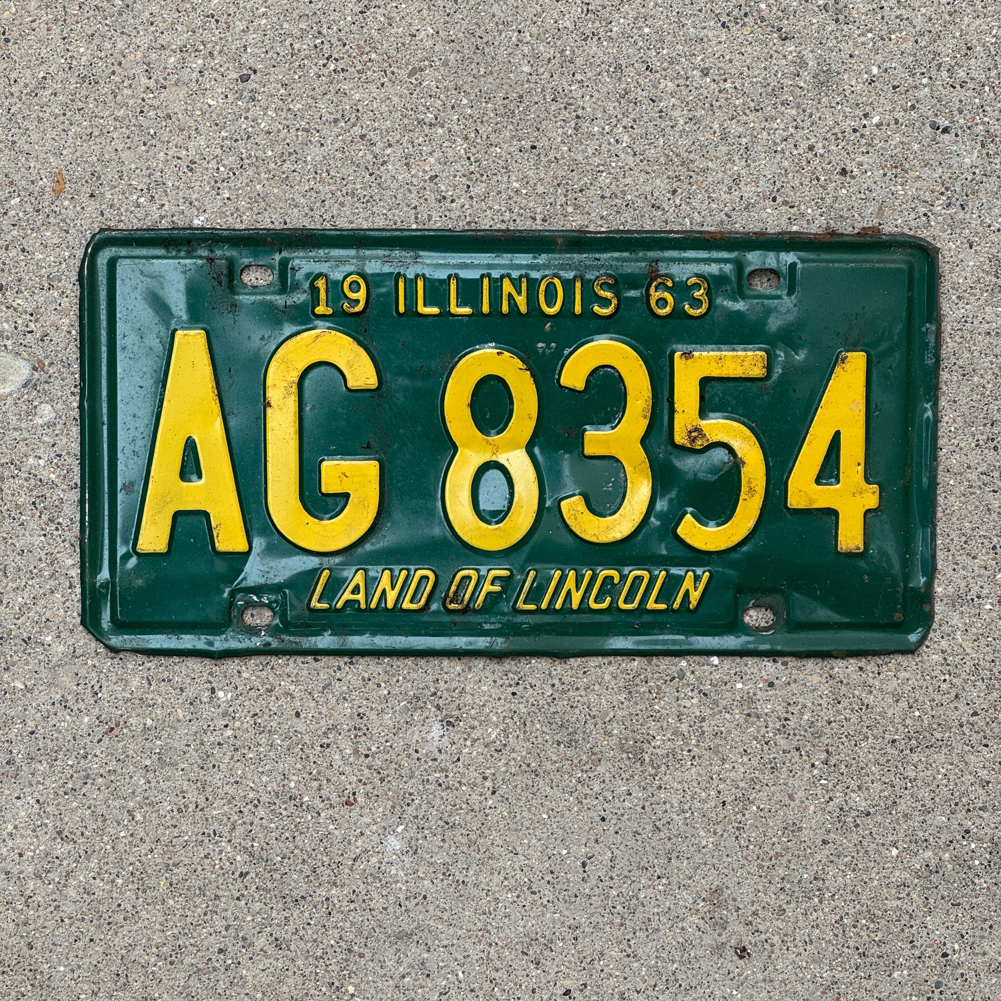 Photo of a 1963 Illinois License Plate Auto Tag 1 Vintage Garage AG 8354 with original patina
