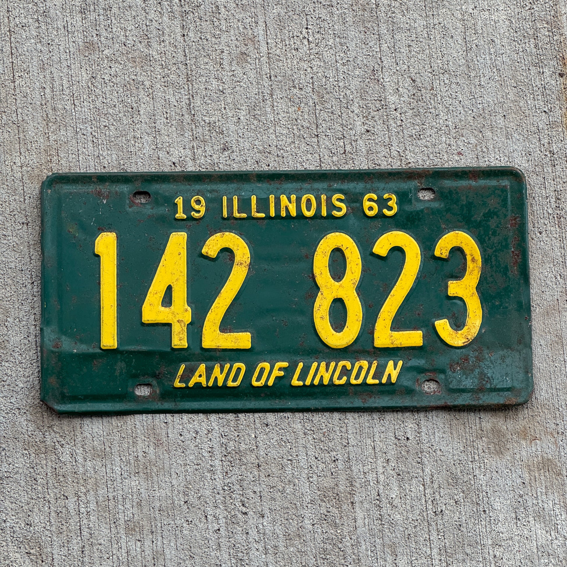 Photo of a 1963 Illinois License Plate Auto Tag 2 Vintage Garage 142 823 with original patina