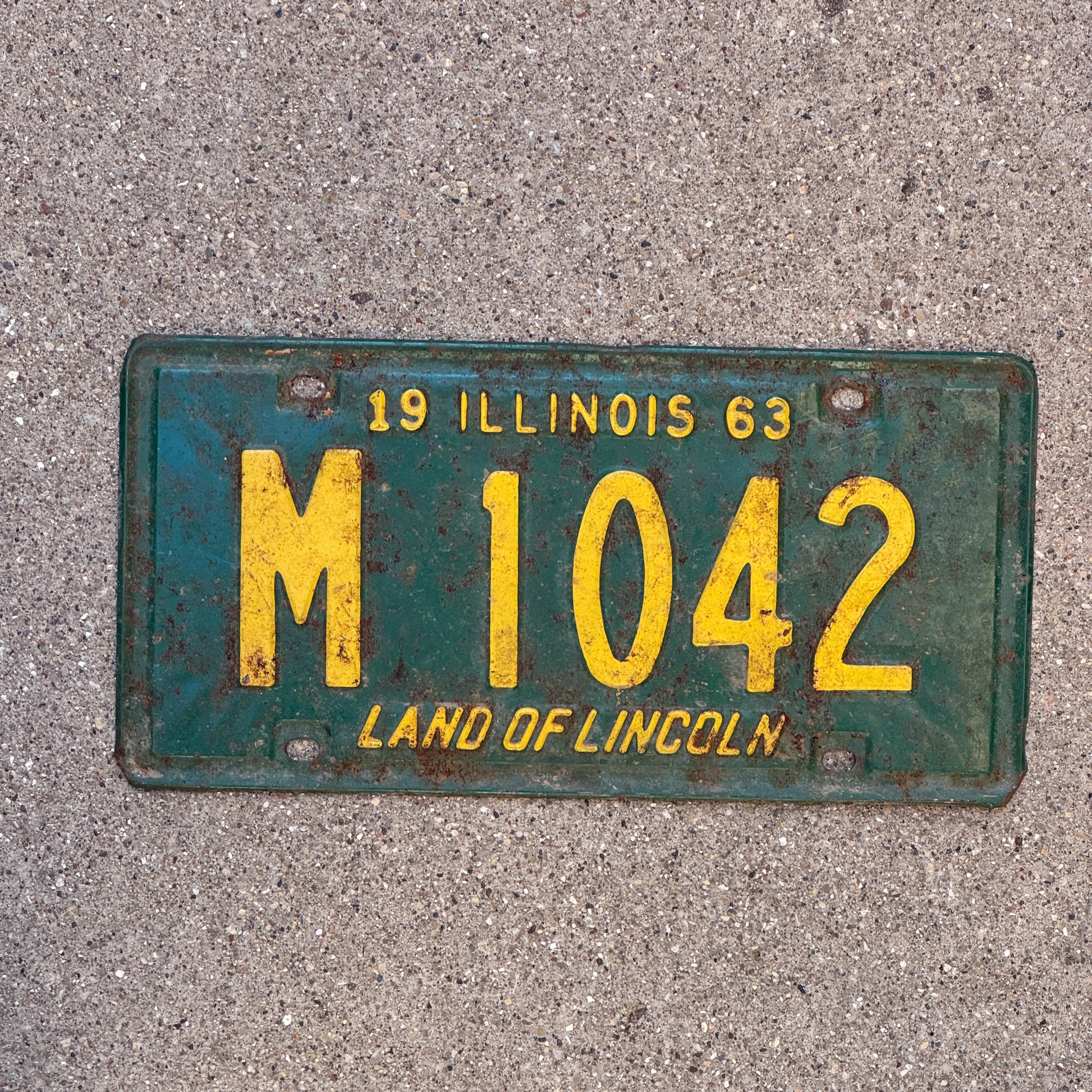 Photo of a 1963 Illinois Municipal License Plate Auto Tag 1 Vintage Garage M 1042 with original patina