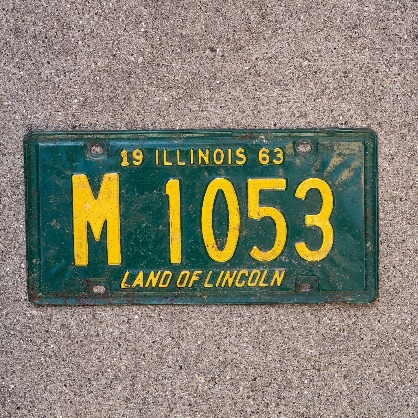 Photo of a 1963 Illinois Municipal License Plate Auto Tag 1 Vintage Garage M 1053 with original patina
