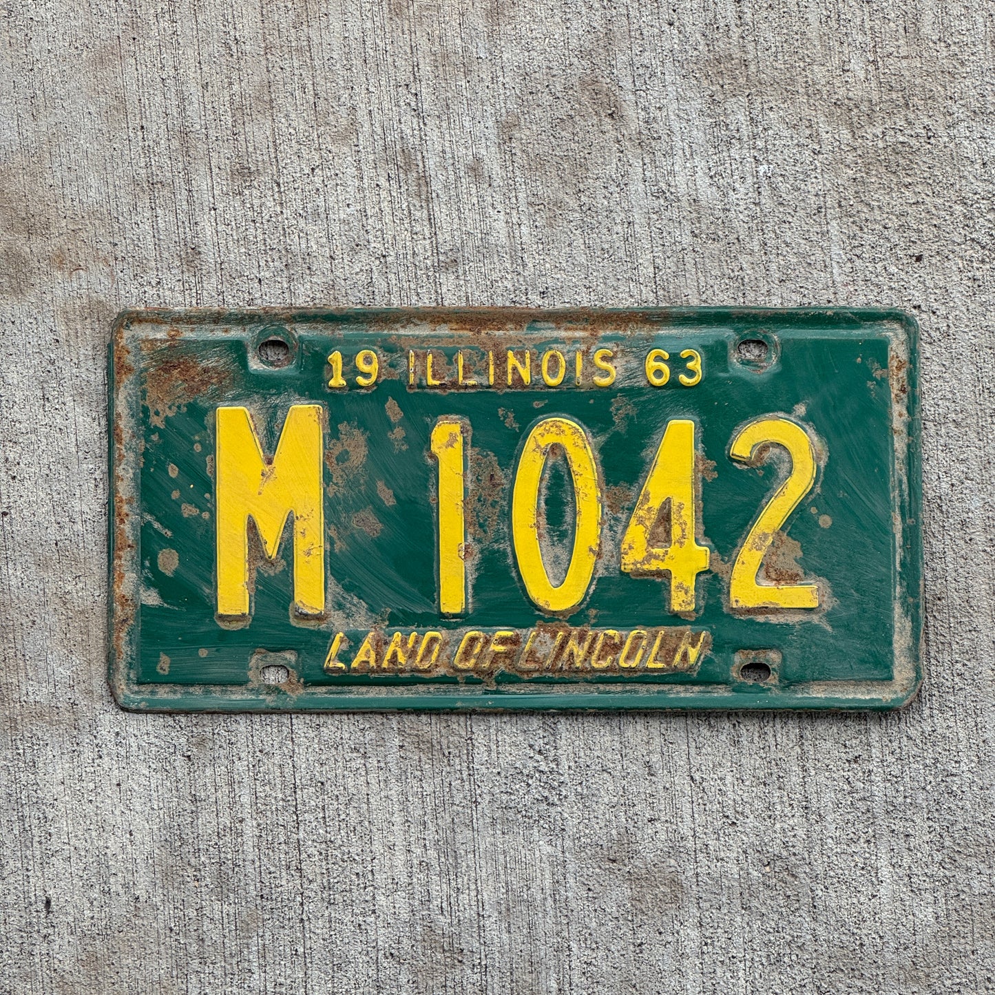 Photo of a 1963 Illinois Municipal License Plate Auto Tag 2 Vintage Garage M 1042 with original patina