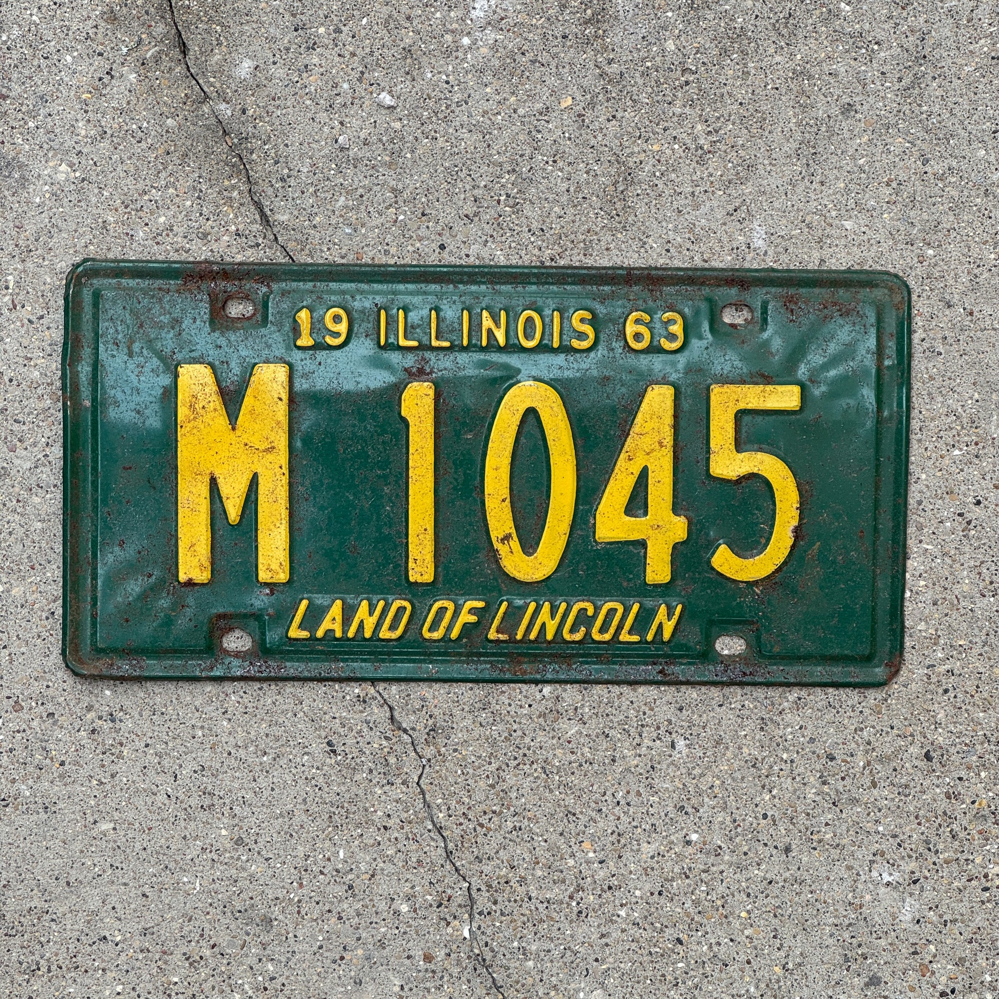 Photo of a 1963 Illinois Municipal License Plate Auto Tag 2 Vintage Garage M 1045 with original patina