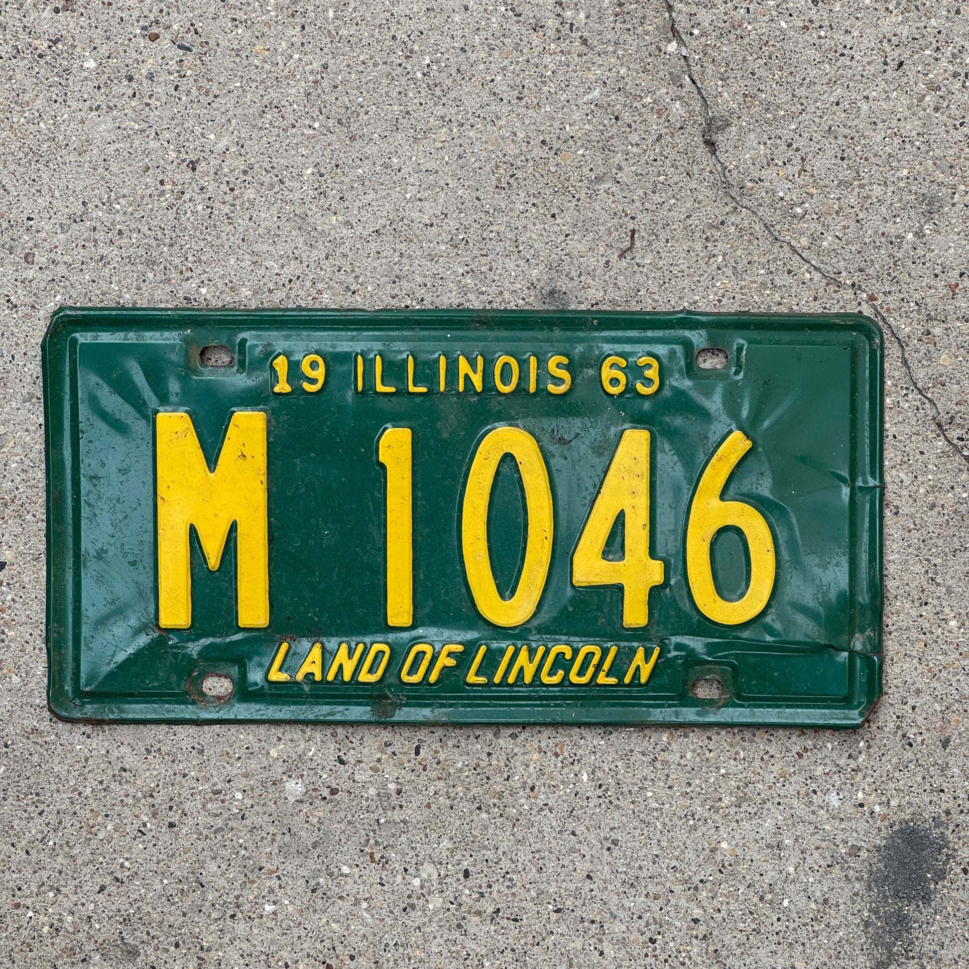 Photo of a 1963 Illinois Municipal License Plate Auto Tag 2 Vintage Garage M 1046 with original patina