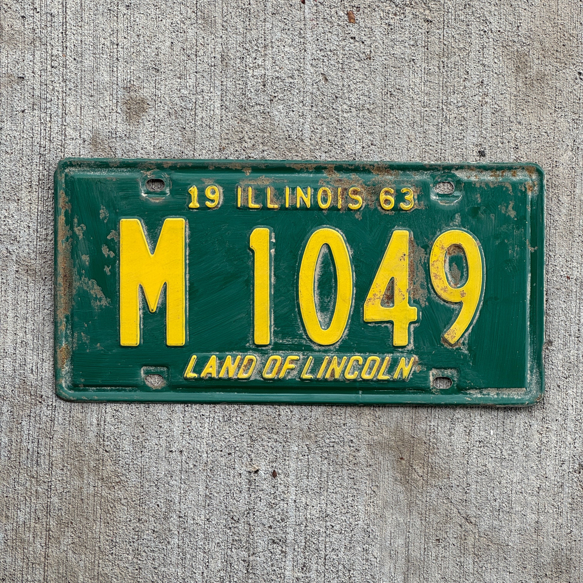 Photo of a 1963 Illinois Municipal License Plate Auto Tag 2 Vintage Garage M 1049 with original patina